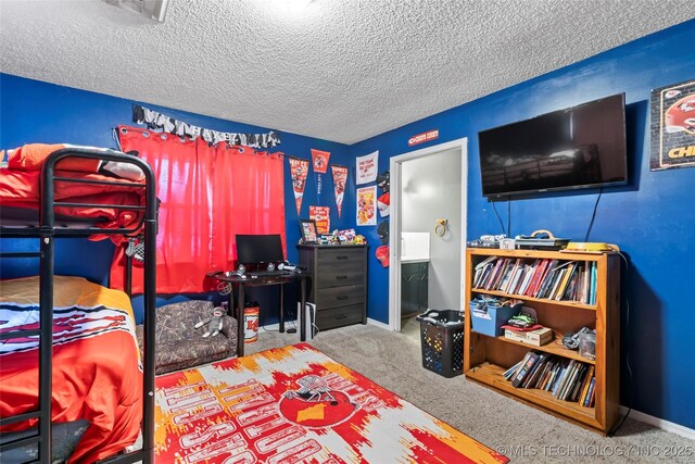 carpeted bedroom featuring a textured ceiling