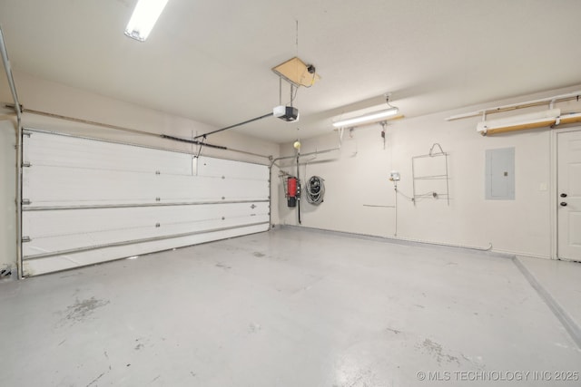 garage with a garage door opener and electric panel