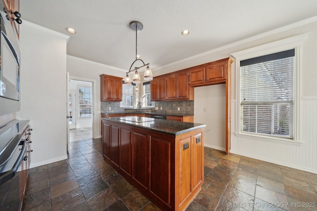 kitchen with pendant lighting, black electric stovetop, crown molding, decorative backsplash, and a kitchen island