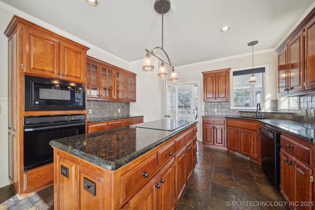 kitchen with black appliances, a center island, pendant lighting, and tasteful backsplash