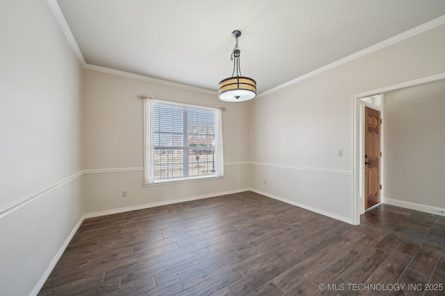spare room with baseboards, dark wood-style floors, and ornamental molding