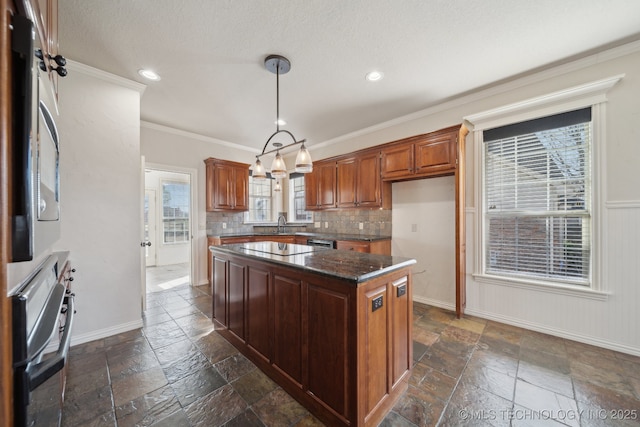kitchen with recessed lighting, stone tile floors, and a center island