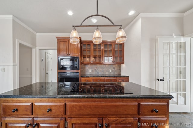 kitchen featuring ornamental molding, black appliances, backsplash, and brown cabinetry