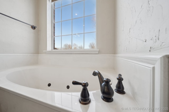 bathroom featuring a washtub