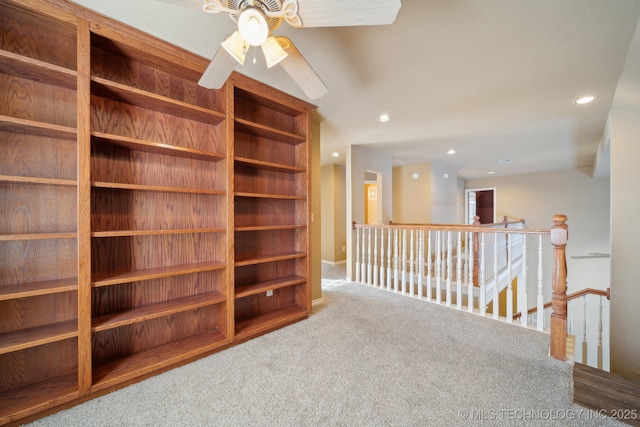 interior space featuring ceiling fan and carpet floors