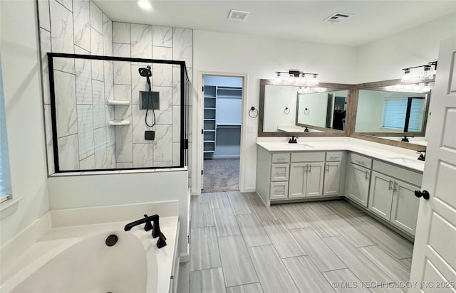 bathroom with vanity and plus walk in shower