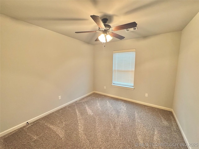 carpeted empty room featuring ceiling fan