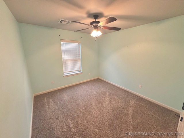 spare room with carpet floors and ceiling fan