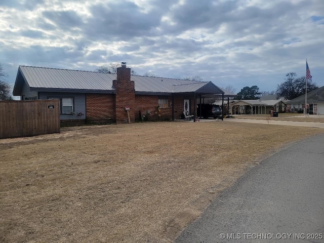 view of front of property with a carport