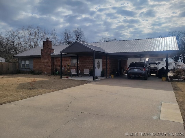 view of front of home with a carport