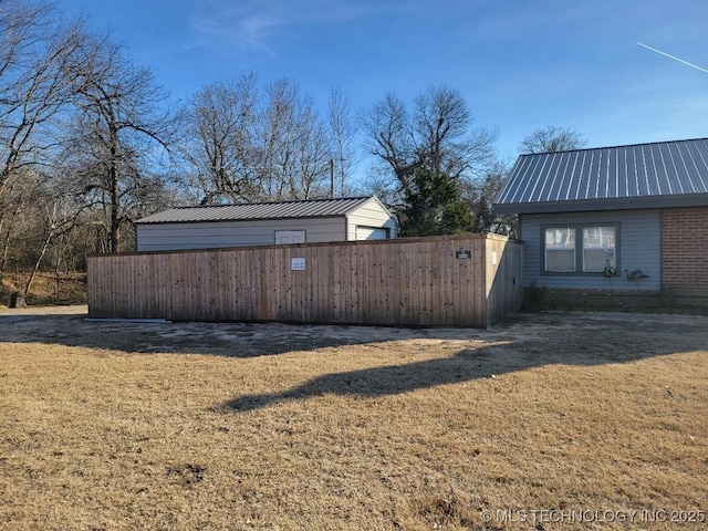 view of side of property with a lawn