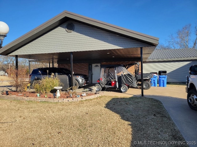 exterior space featuring a yard and a carport