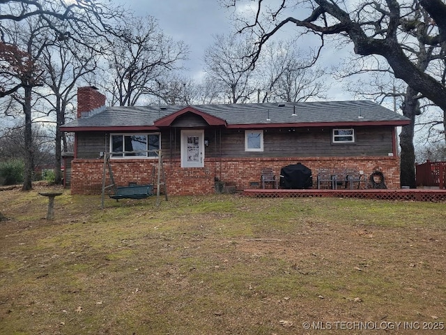 ranch-style house with a front lawn