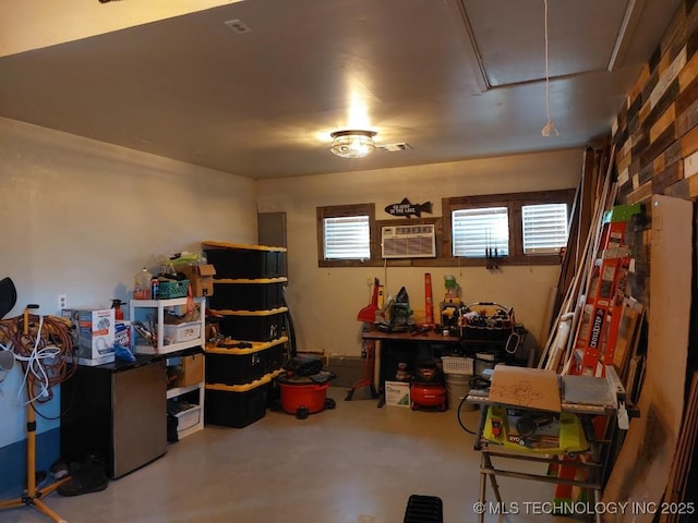 storage room with a wall mounted air conditioner