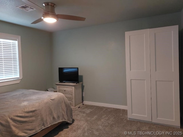 bedroom featuring ceiling fan and light carpet