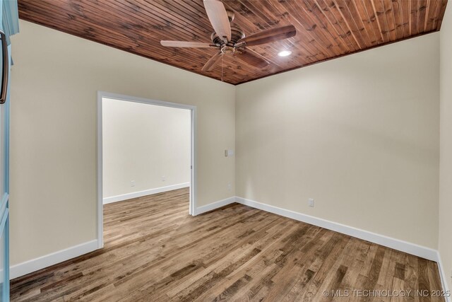 spare room with hardwood / wood-style flooring, ceiling fan, wooden ceiling, and crown molding