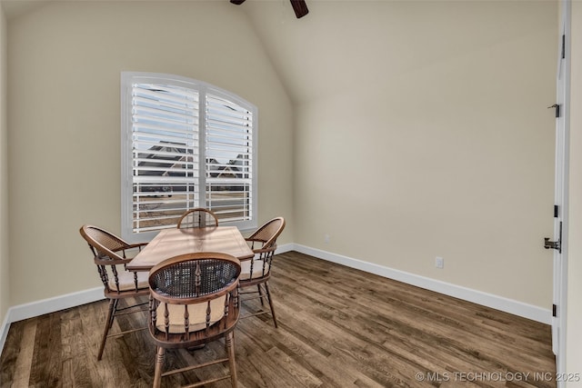 dining area with ceiling fan, lofted ceiling, and hardwood / wood-style flooring