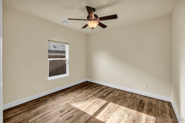 spare room featuring ceiling fan and wood-type flooring