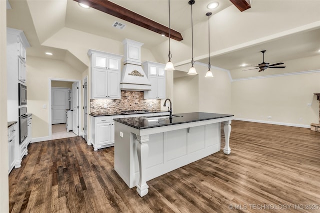 kitchen featuring ceiling fan, sink, vaulted ceiling with beams, dark hardwood / wood-style floors, and white cabinetry