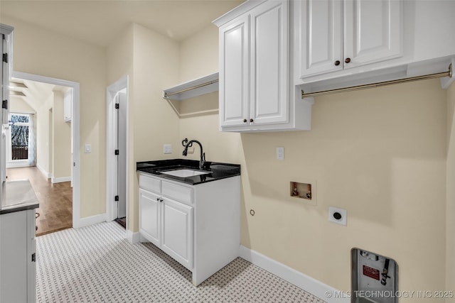 laundry room with cabinets, washer hookup, hookup for an electric dryer, and sink