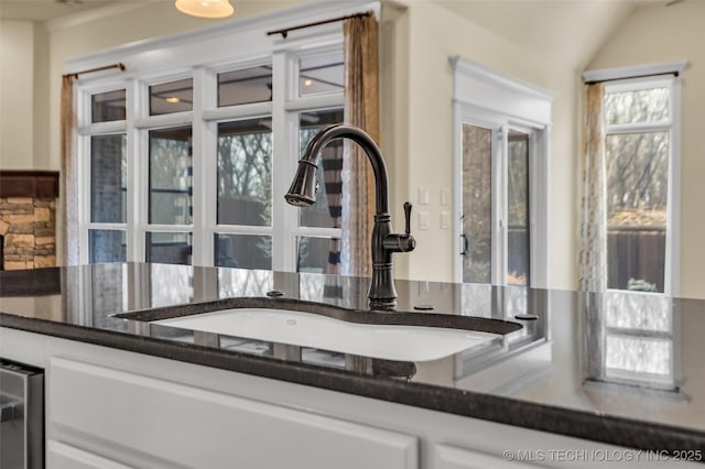 interior details with sink and white cabinets