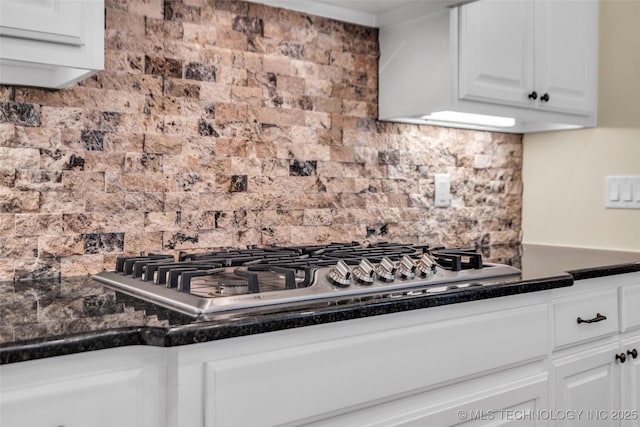 kitchen with decorative backsplash, white cabinetry, and stainless steel gas cooktop