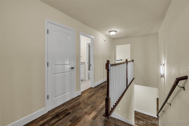 hallway with dark hardwood / wood-style flooring