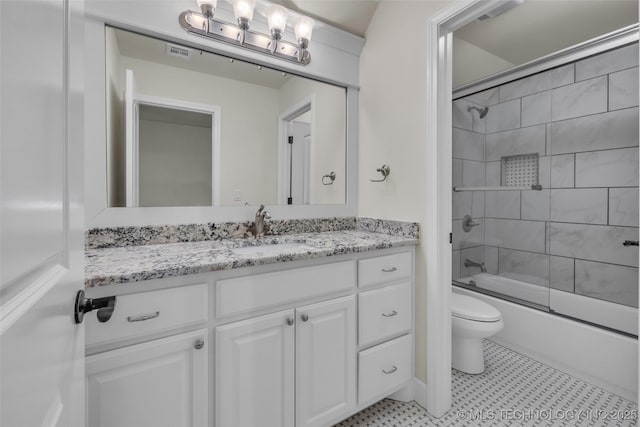 full bathroom featuring vanity, toilet, and enclosed tub / shower combo