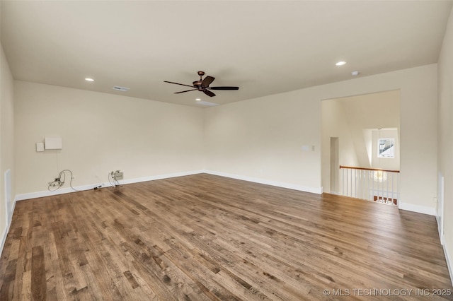 spare room with ceiling fan and wood-type flooring