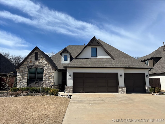 view of front of house with stone siding, concrete driveway, roof with shingles, and an attached garage