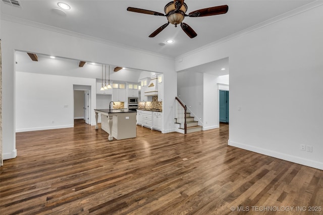12050 S 68th E Ave E, Bixby, OK 74008 - unfurnished living room featuring ornamental molding, a ceiling fan, dark wood-style flooring, stairway, and recessed lighting