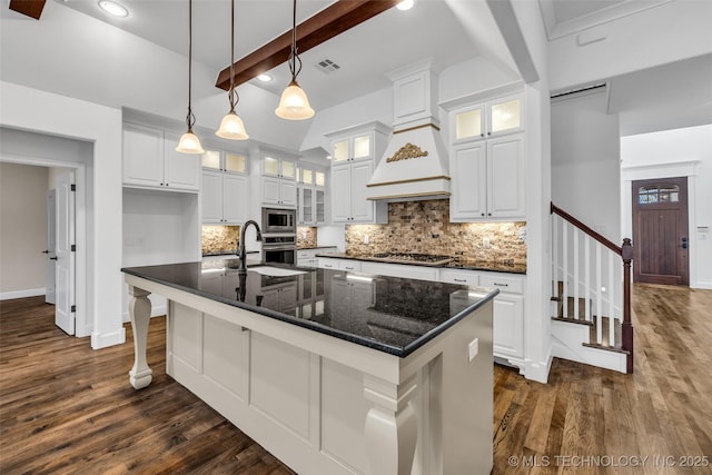 12050 S 68th E Ave E, Bixby, OK 74008 - kitchen featuring appliances with stainless steel finishes, dark wood finished floors, backsplash, beamed ceiling, and recessed lighting