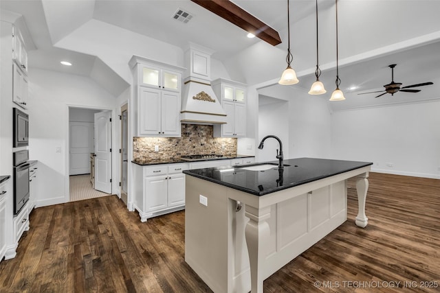 12050 S 68th E Ave E, Bixby, OK 74008 - kitchen with a ceiling fan, decorative backsplash, dark wood finished floors, white cabinetry, and recessed lighting