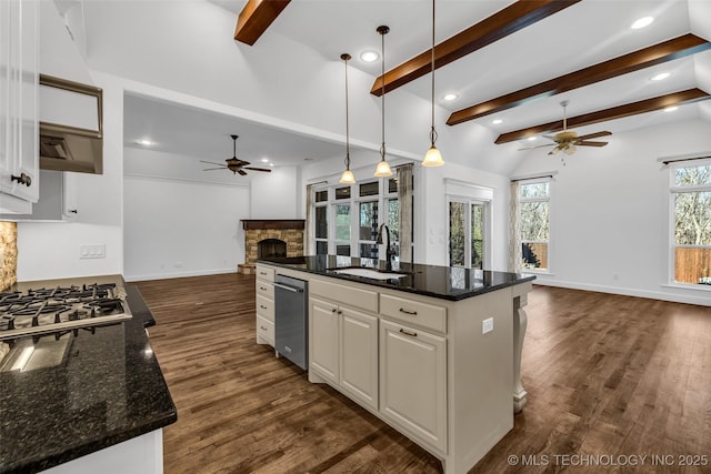 12050 S 68th E Ave E, Bixby, OK 74008 - kitchen with open floor plan, a ceiling fan, a fireplace, appliances with stainless steel finishes, and recessed lighting