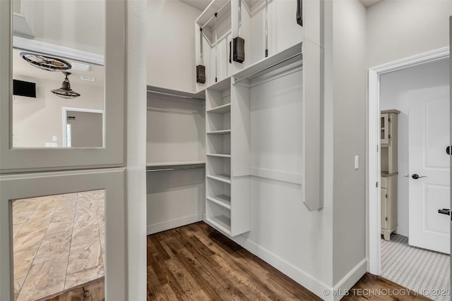 12050 S 68th E Ave E, Bixby, OK 74008 - walk in closet featuring dark wood-style flooring