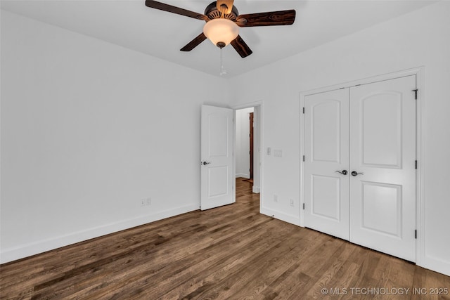 12050 S 68th E Ave E, Bixby, OK 74008 - unfurnished bedroom with wood finished floors, a closet, and a ceiling fan