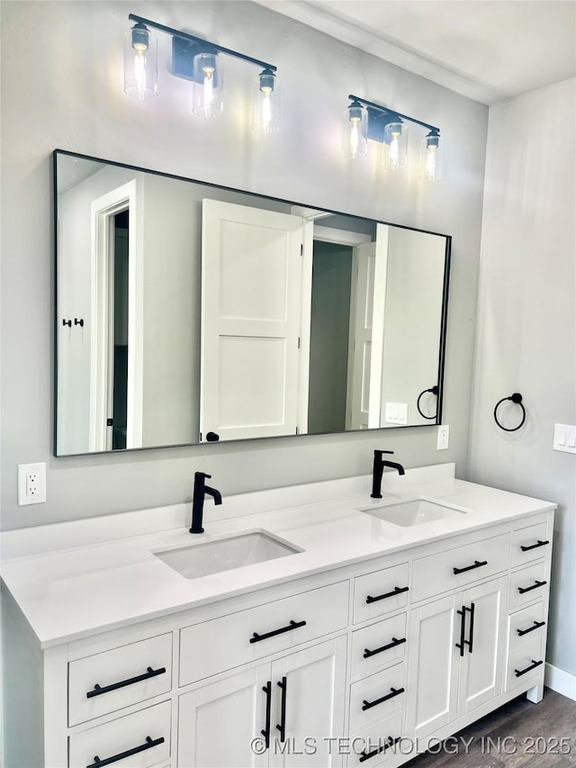 bathroom featuring wood-type flooring and vanity