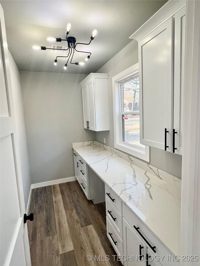 laundry room with hardwood / wood-style floors