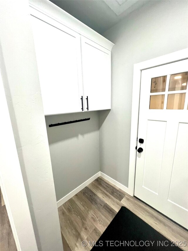 washroom with wood-type flooring