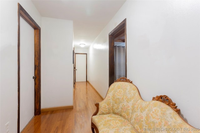 hallway with light wood-type flooring