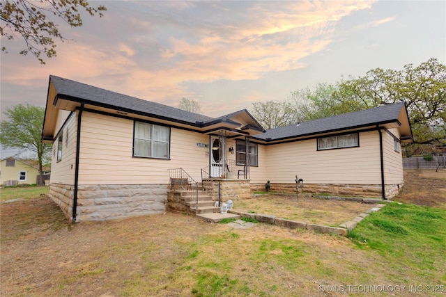 view of front of home with a yard