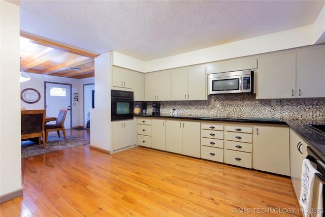 kitchen featuring backsplash, light hardwood / wood-style flooring, beamed ceiling, and stainless steel appliances