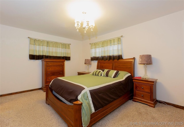 bedroom featuring light carpet and a notable chandelier