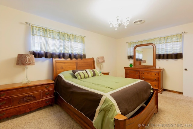 carpeted bedroom featuring multiple windows