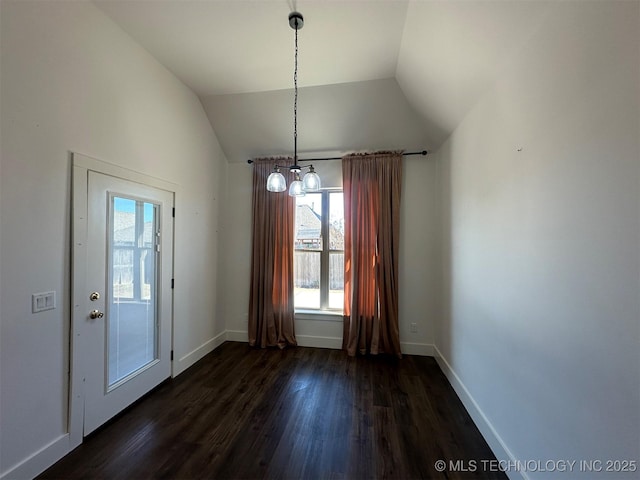 unfurnished dining area featuring a notable chandelier, dark hardwood / wood-style flooring, and vaulted ceiling