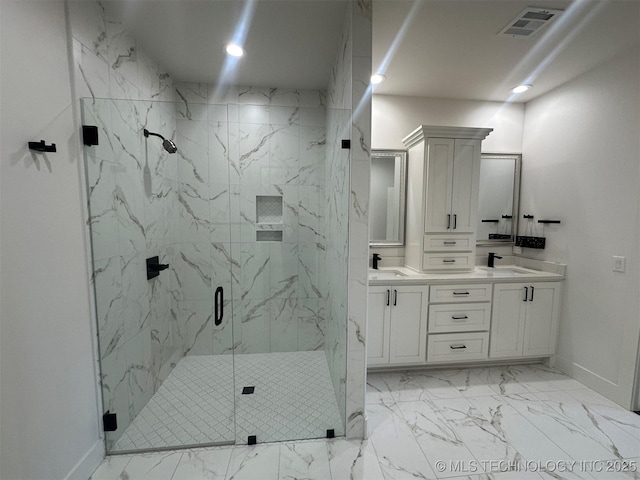 bathroom with vanity and an enclosed shower