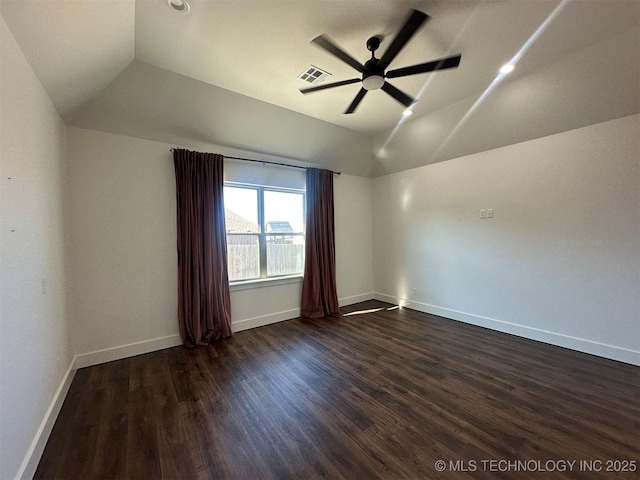 unfurnished room featuring ceiling fan, dark hardwood / wood-style flooring, and vaulted ceiling