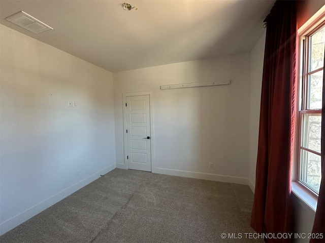 view of carpeted spare room