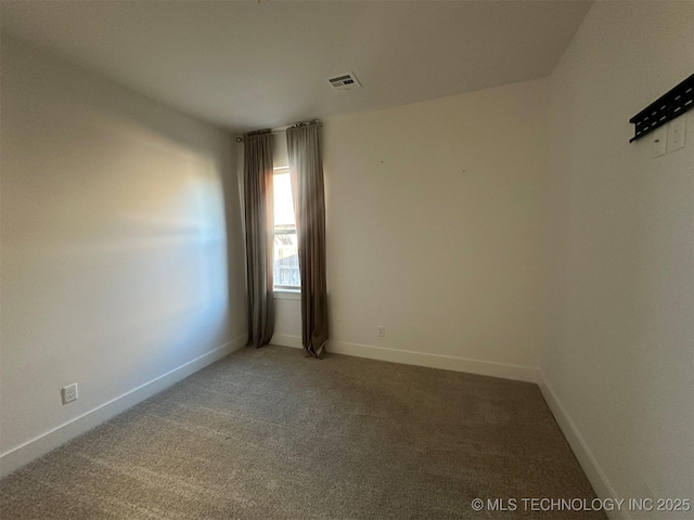 unfurnished room with carpet floors