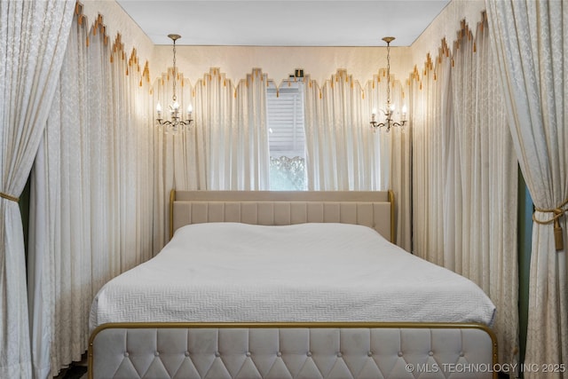 bedroom featuring radiator heating unit and an inviting chandelier